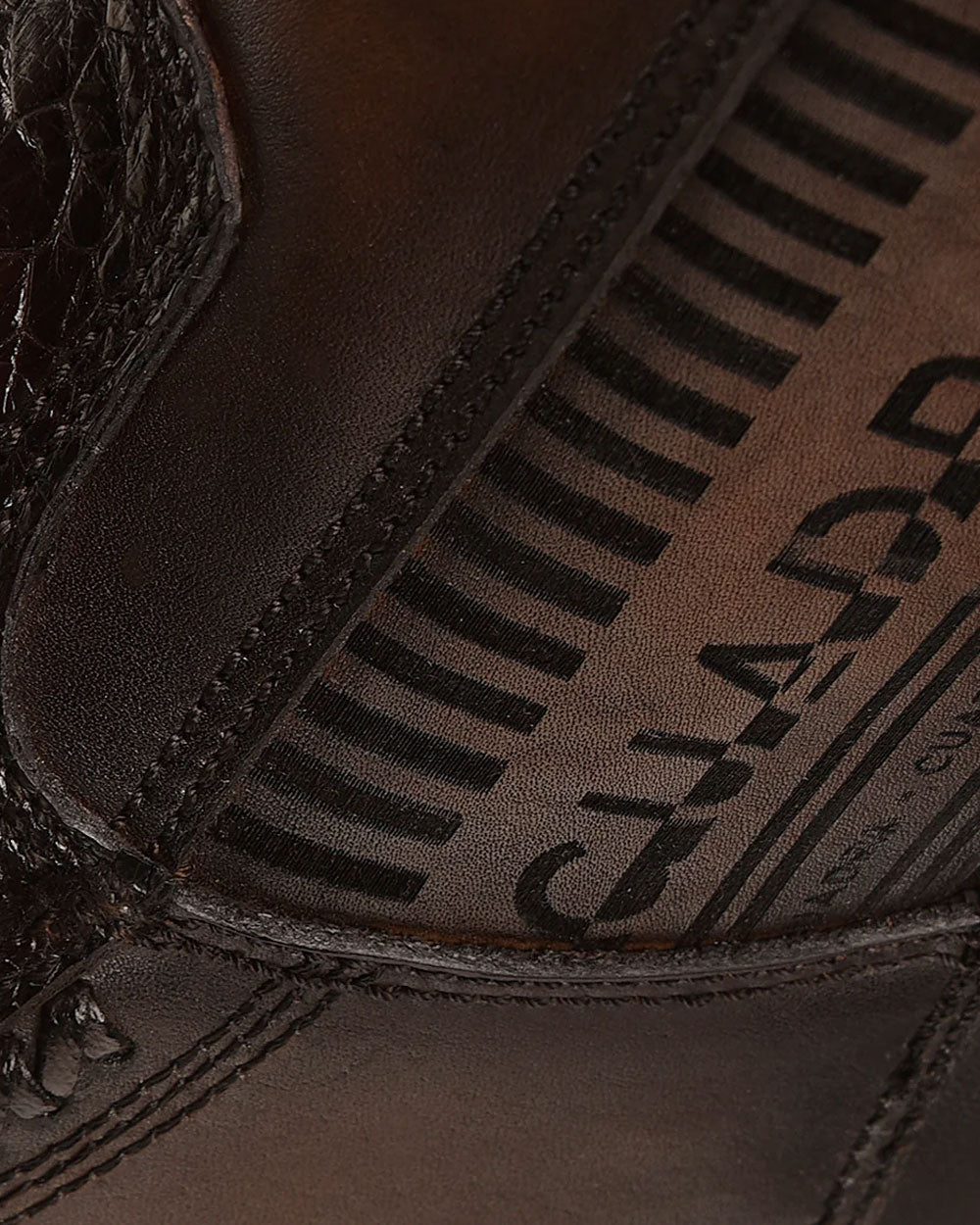 Laser Engraved Logo: Detailed craftsmanship on Cuadra's traditional boots. 