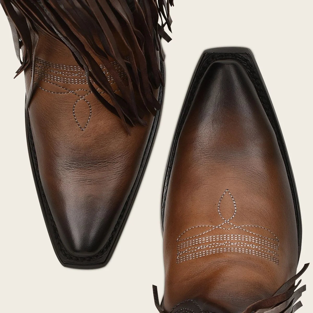 Brown fringed cowboy boot