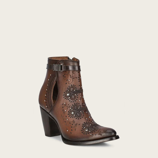 Brown embroidered leather booties, details of perforation, embroidery in geometric motifs and application of studs and authentic Austrian crystals.