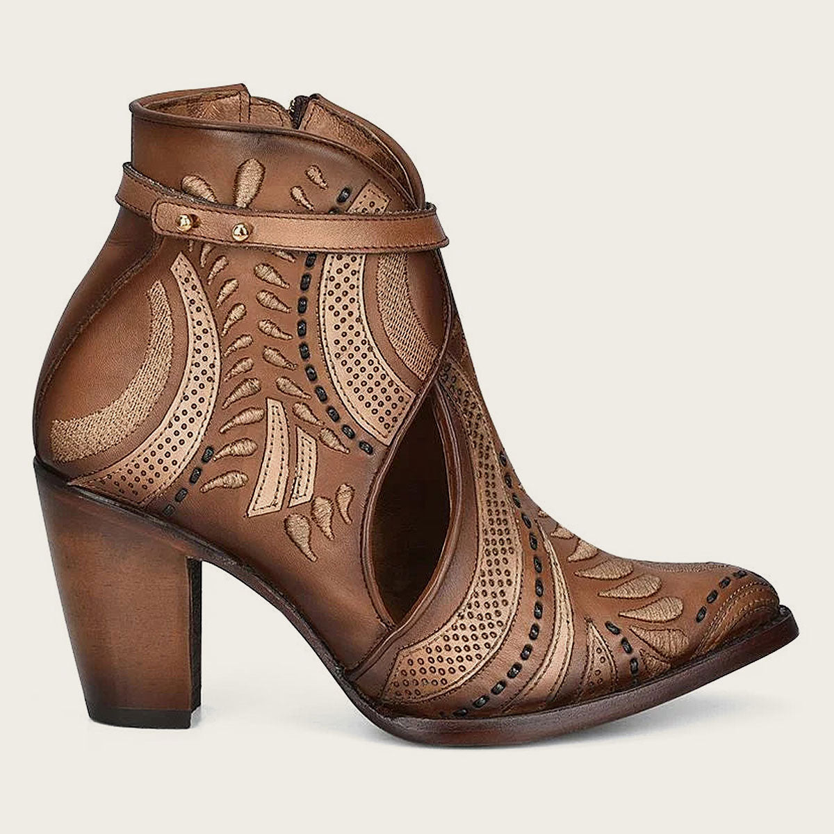 Embroidered and perforated in geometric motifs honey leather bootie