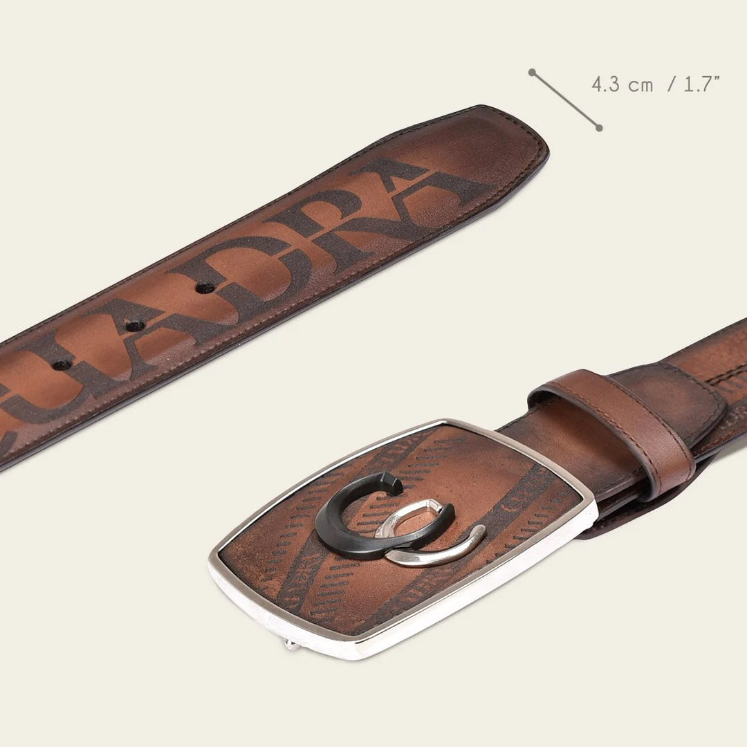 Engraved honey brown leather western belt with cuadra black and silver monogram