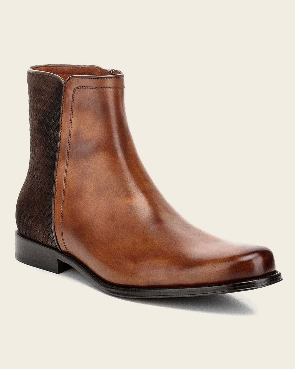 Artisanal honey leather boot with hand-painted finish and intricate handwoven application on the sides. Stand out in style.