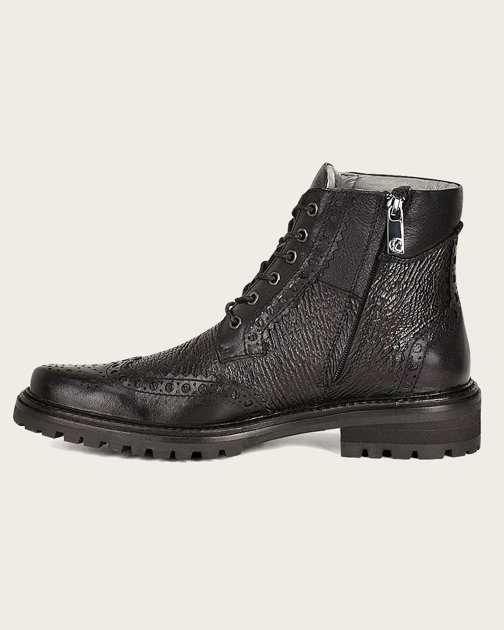 Luxury Meets Style: Cuadra's hand-painted black shark leather ankle boots.