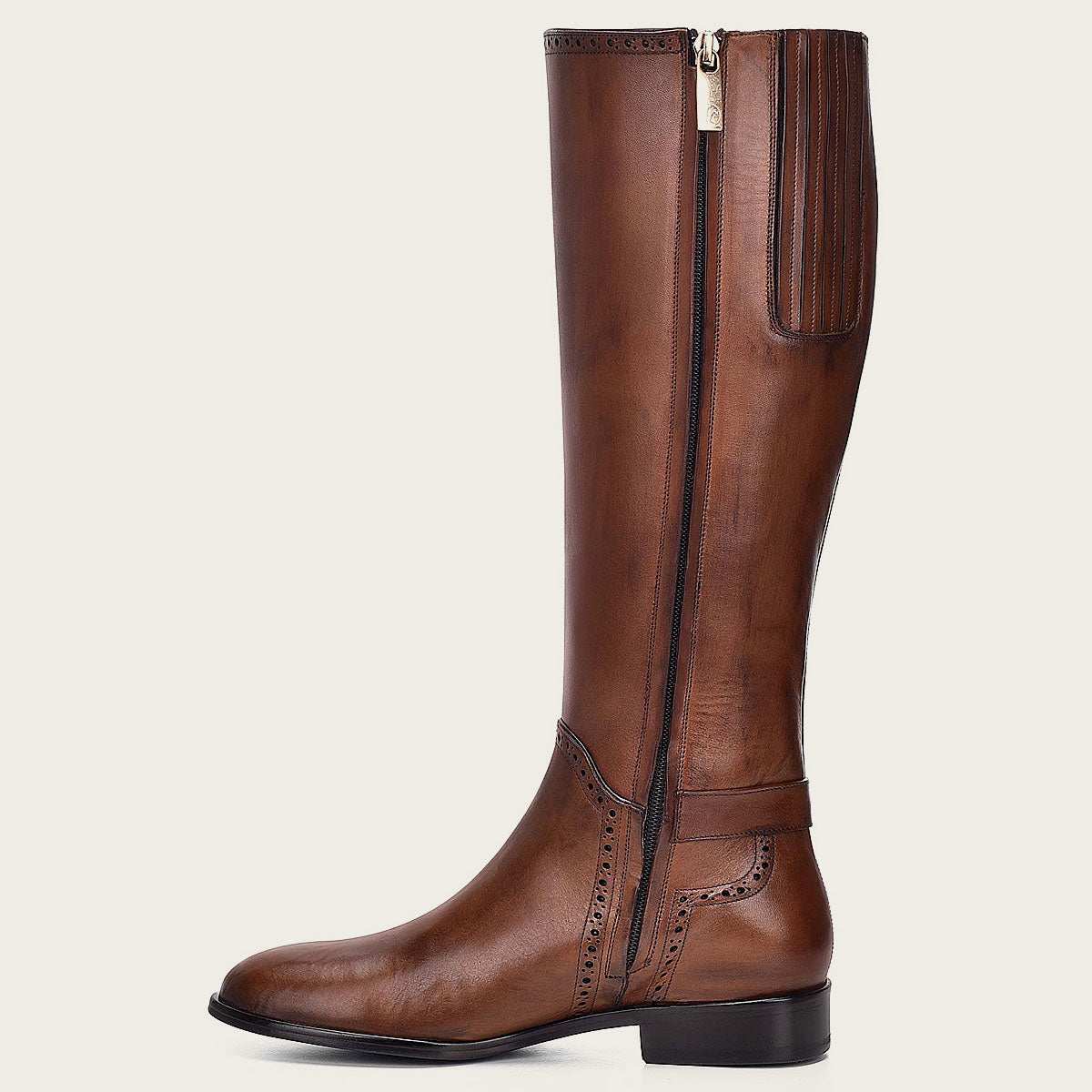 A beautiful honey-colored leather riding boot, hand-painted with intricate details, perfect for the fashion-forward equestrian.