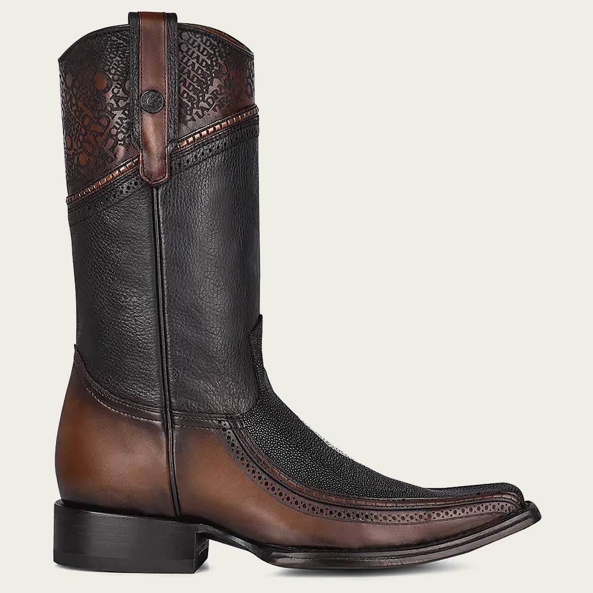 Authentic cowboy boot with intricate engravings and timeless style for a classic Western look.