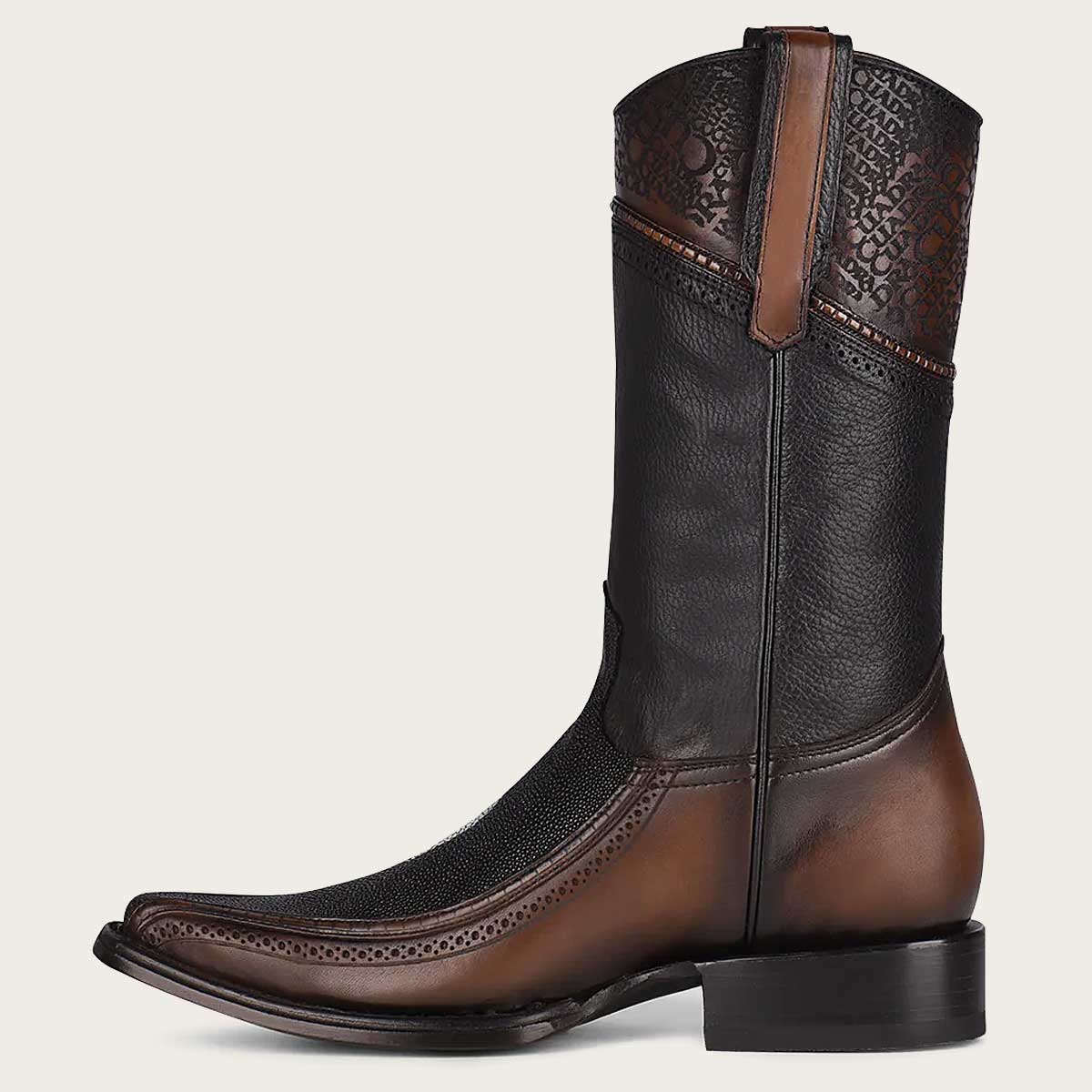 Authentic cowboy boot with intricate engravings and timeless style for a classic Western look.