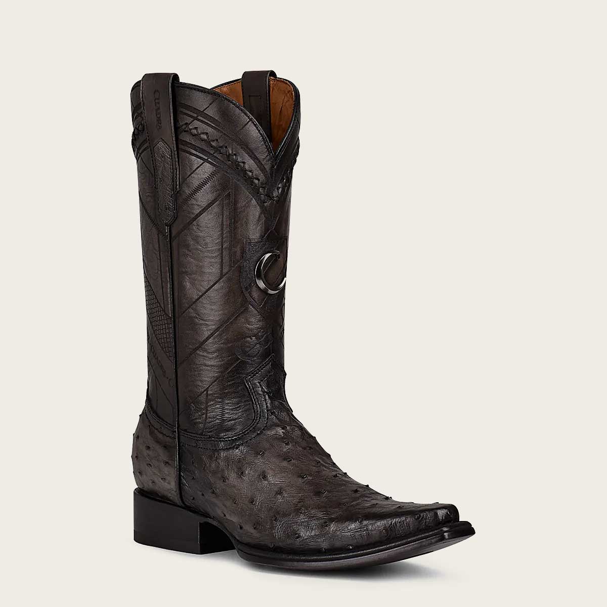 Stylish grey boot crafted from exotic leather with intricate engravings for a unique touch.