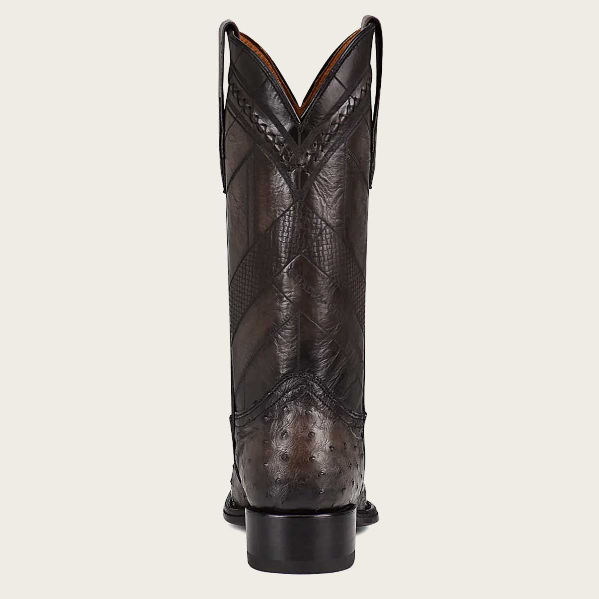 Stylish grey boot crafted from exotic leather with intricate engravings for a unique touch.