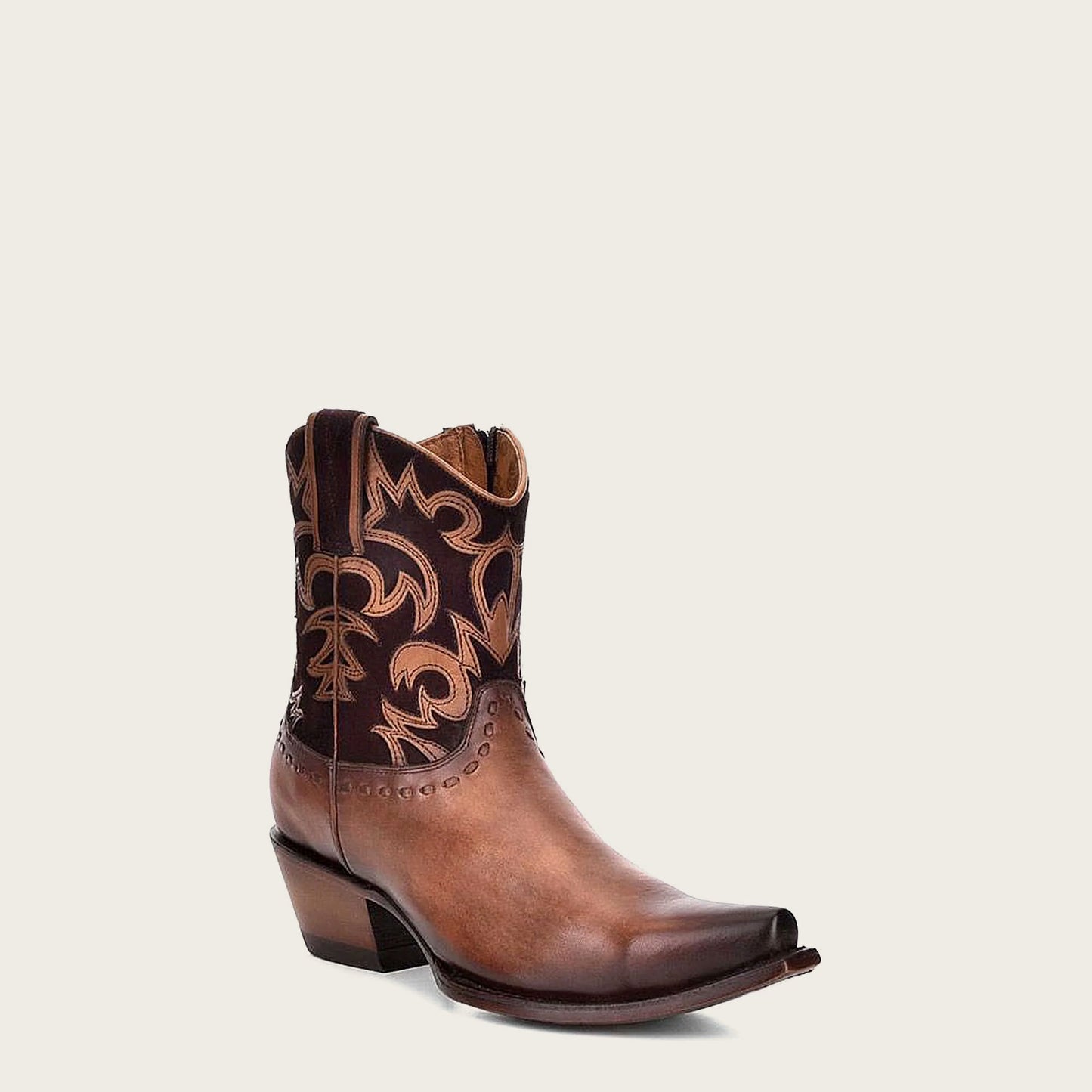 Brown Western leather bootie - high-quality leather with classic pointed toe and slanted heel, versatile for any occasion.