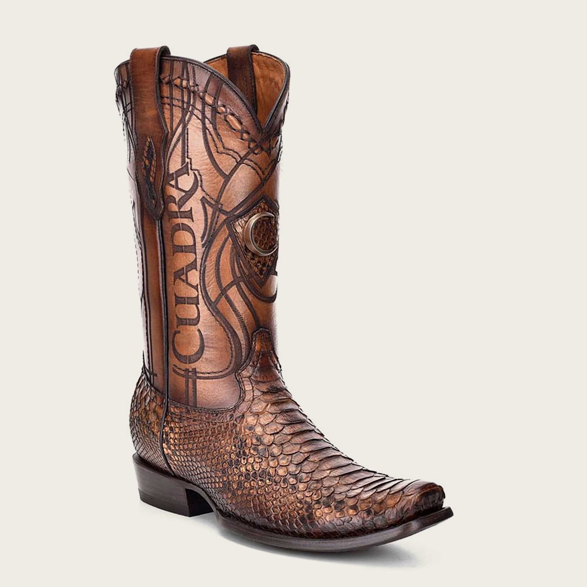 Stylish honey python leather Western boot with intricate engraving and hand-painted finish.