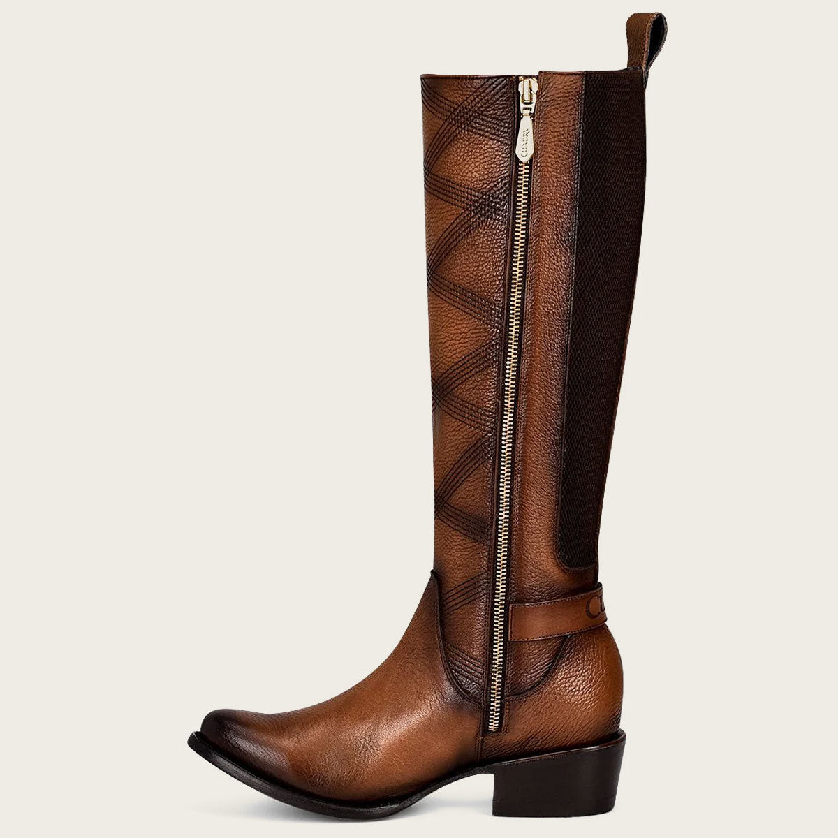 A beautiful honey-colored leather boot with intricate embroidery, perfect for adding a touch of elegance to any outfit.