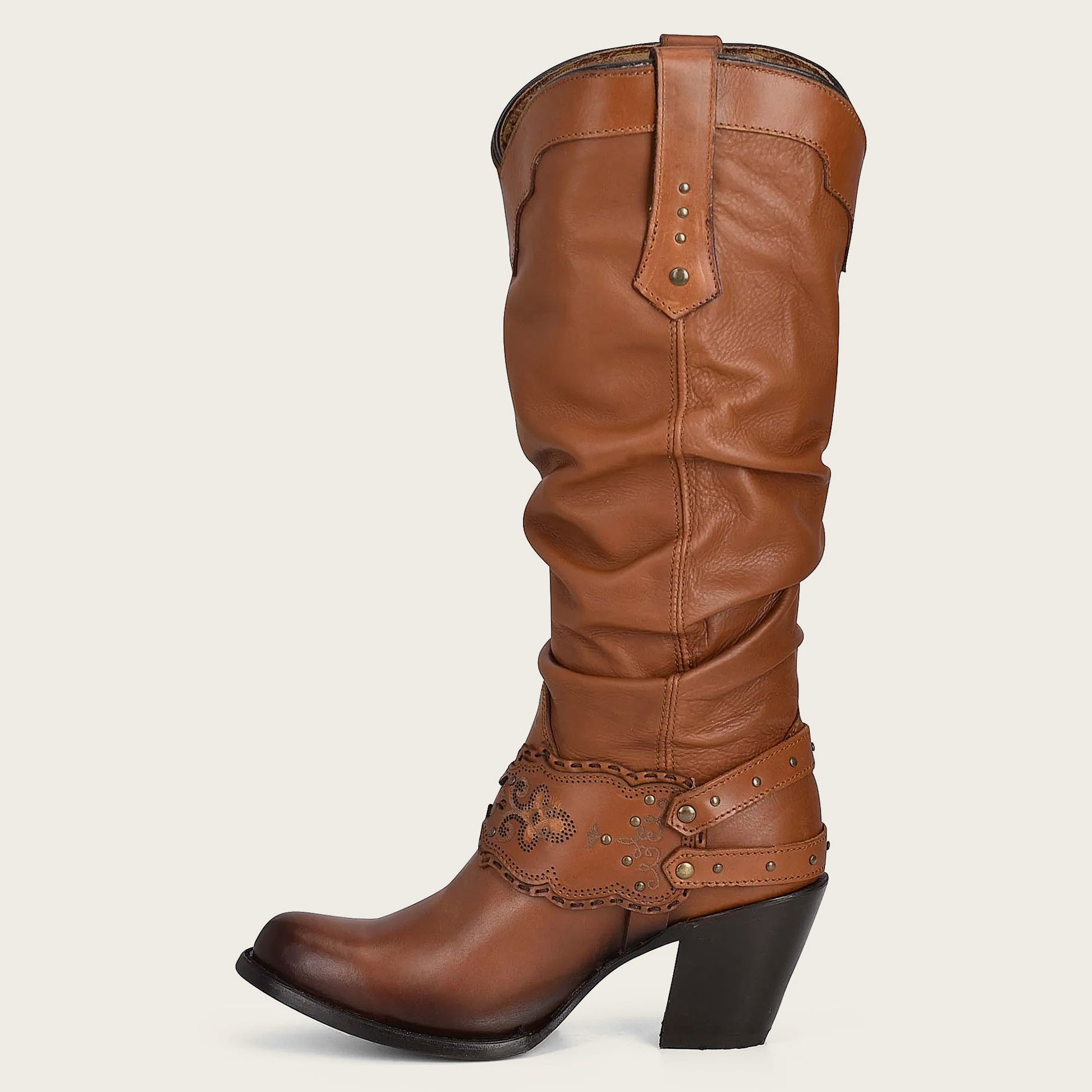 Make a bold statement and showcase your individuality with these eye-catching engraved honey leather tall boots.