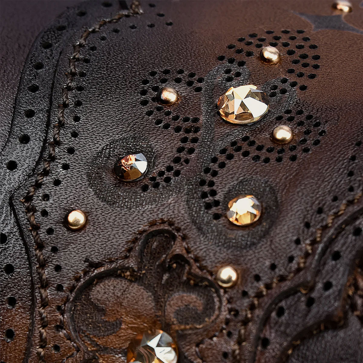 The harness is adorned with crystals, metallic studs, and laser engravings, exuding intricate elegance.