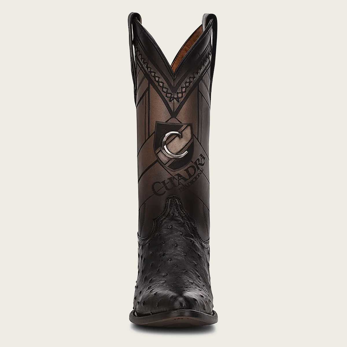 Stylish men's western boot crafted from genuine ostrich leather with intricate laser-engraved details.
