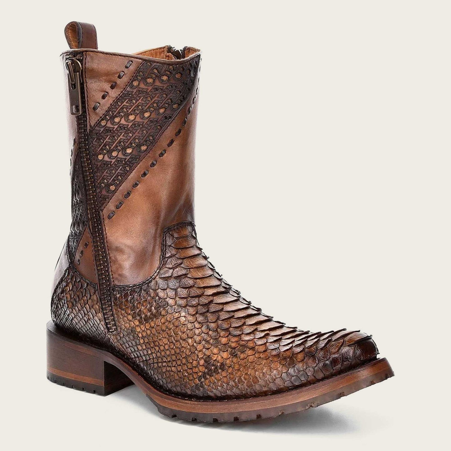 Step out in style with these engraved honey leather boots featuring intricate designs that add a touch of elegance and sophistication to your look.