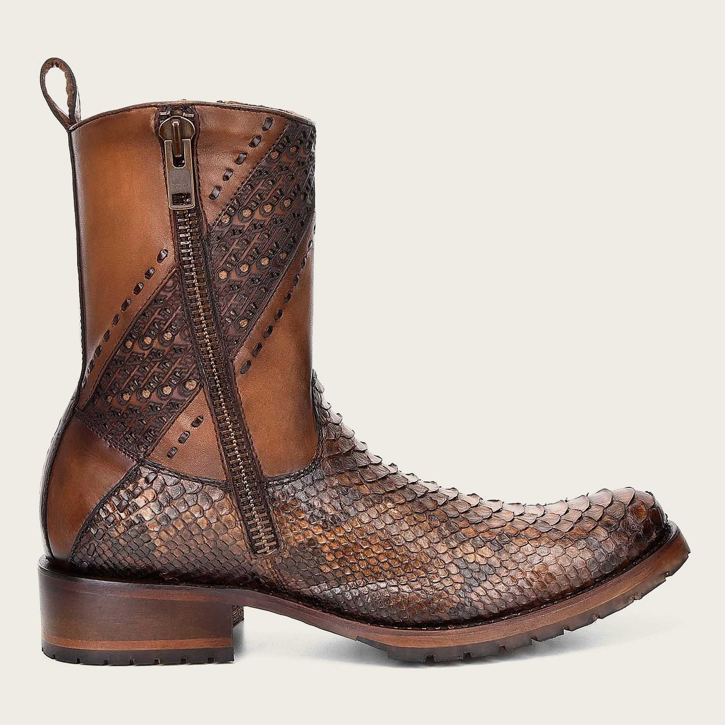 Step out in style with these engraved honey leather boots featuring intricate designs that add a touch of elegance and sophistication to your look.