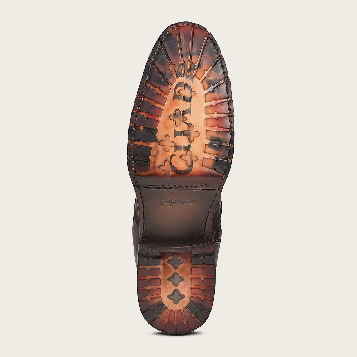 Hand-painted honey leather men's boot with engraved logo and perforated details