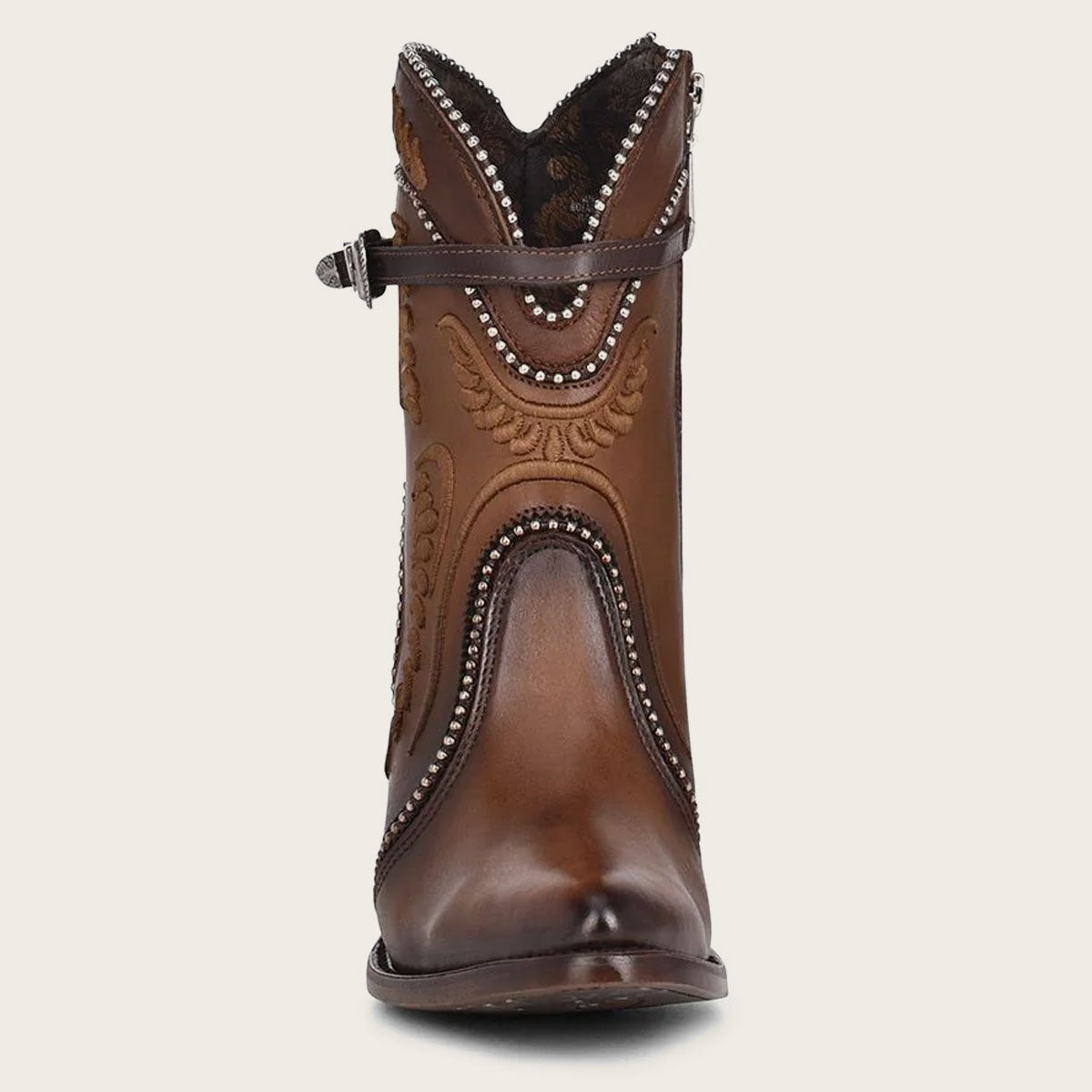 These boots combine style and practicality with a leather strap, metallic buckle, and inner zipper for easy on-and-off.