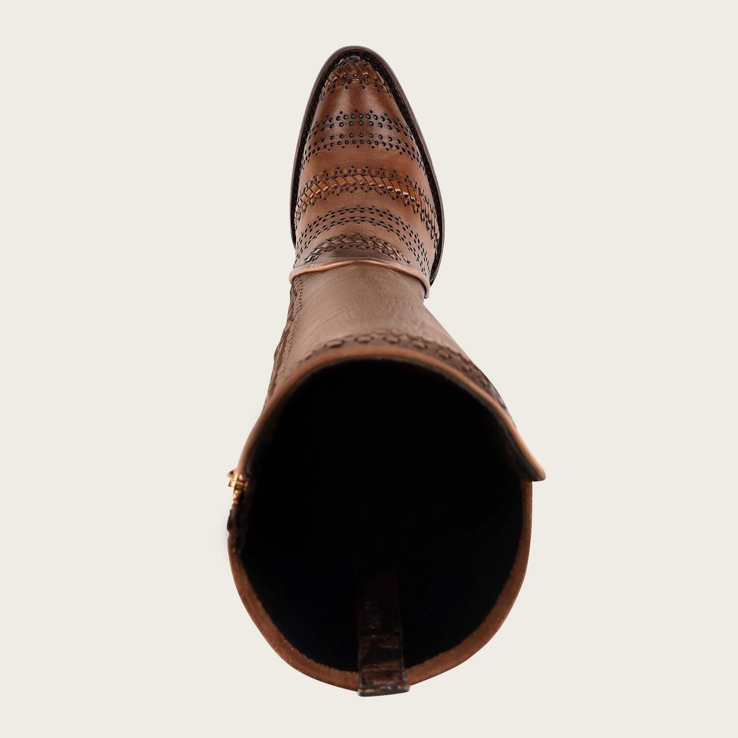 A close-up of a handwoven brown leather boot, with intricate details and sturdy craftsmanship.