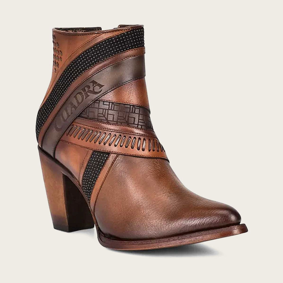 Brown hand-painted leather ankle bootie with decorative accents.