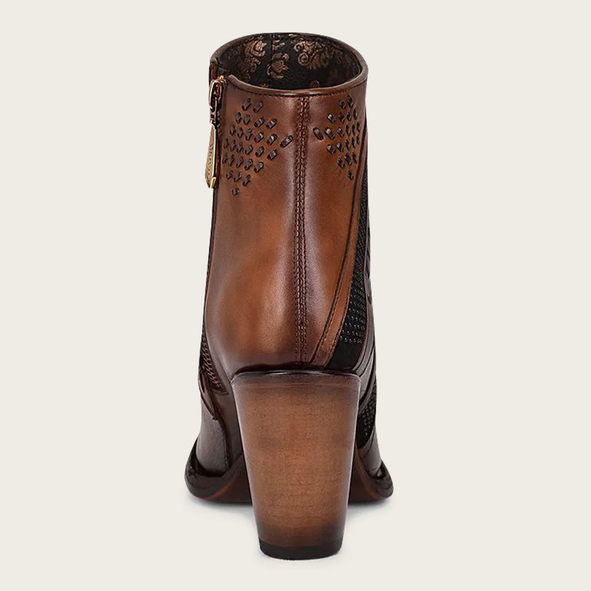 Brown hand-painted leather ankle bootie with decorative accents.