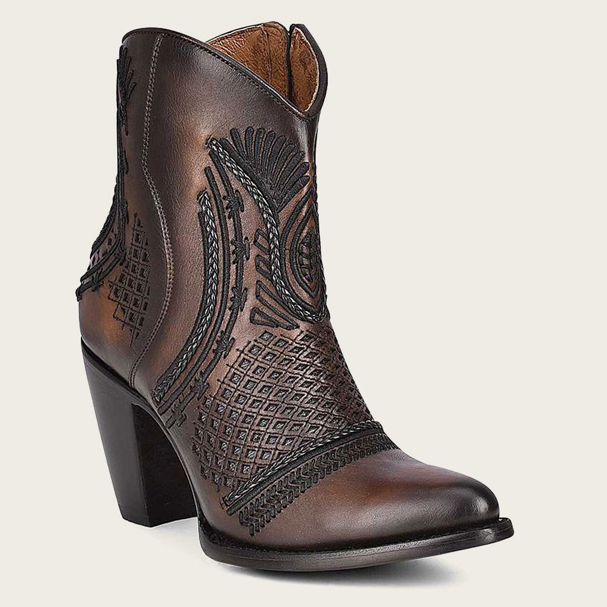 artisan brown leather booties. Perfect for both casual and formal occasions, they're sure to make a statement wherever you go
