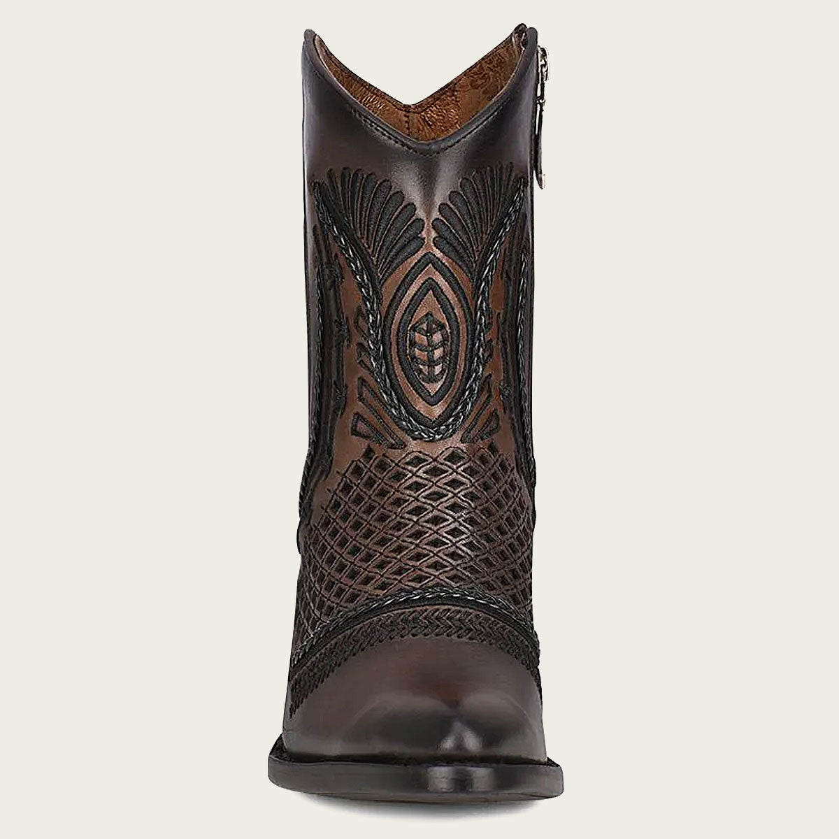 Artisan brown leather booties. Embroidery, and handcrafted fabric on the front and sides create a captivating visual impact