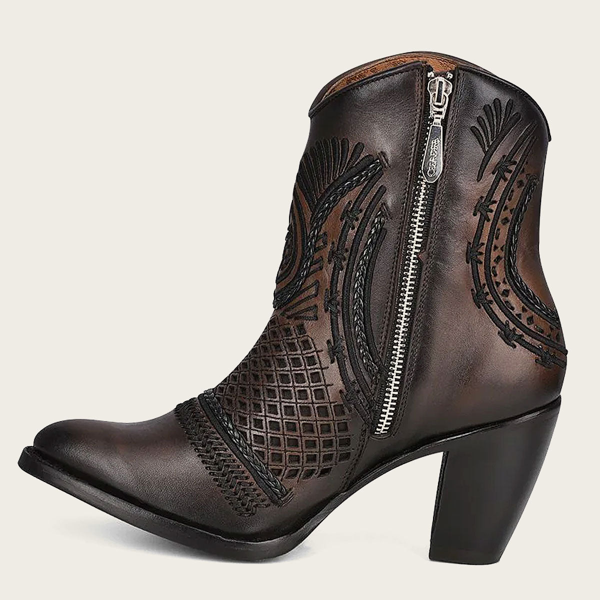 Artisan brown leather booties. The internal closure allows for easy adjustment, ensuring a snug and secure fit.