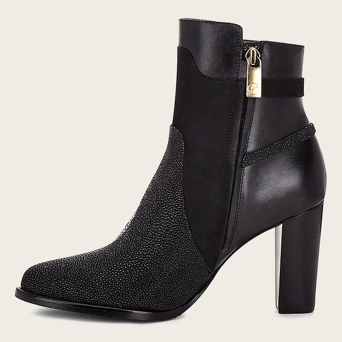 Close-up of black textured ankle boot with pointed toe, made of genuine exotic stingray leather.