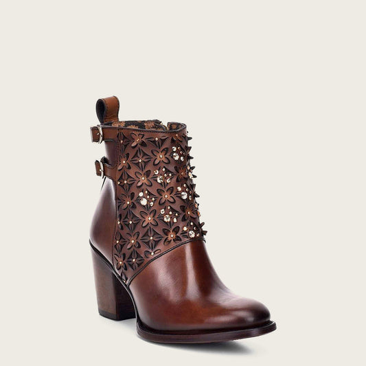 Handcrafted perforated brown leather bootie adorned with Austrian crystals.