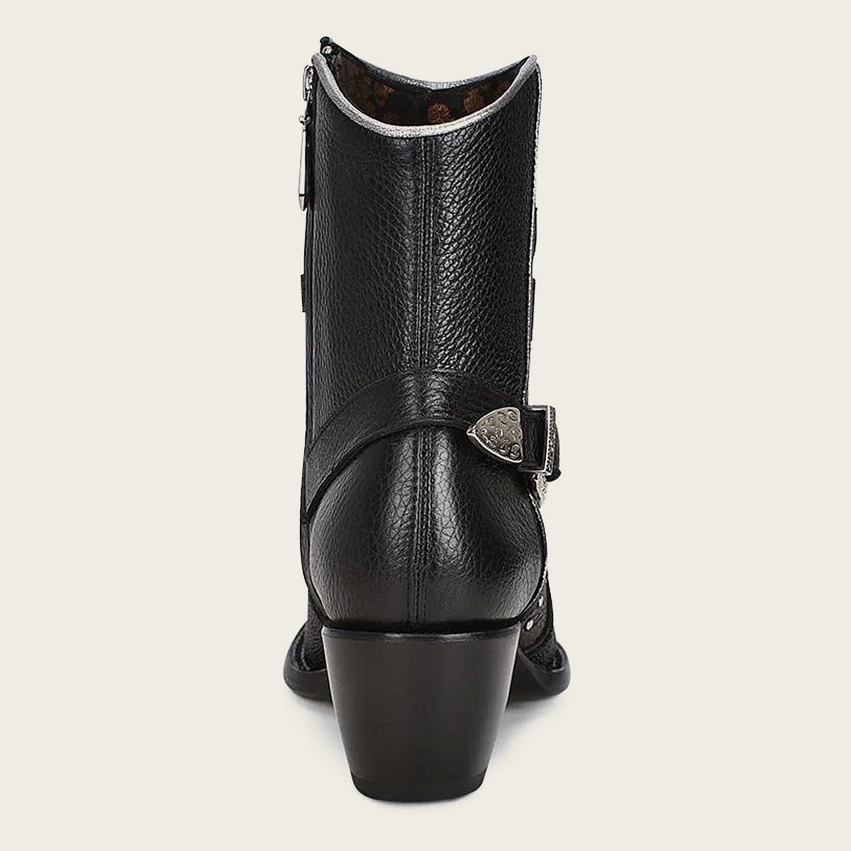 The leather strap at the back, with a decorative metal buckle, adds sophistication to these ankle boots.