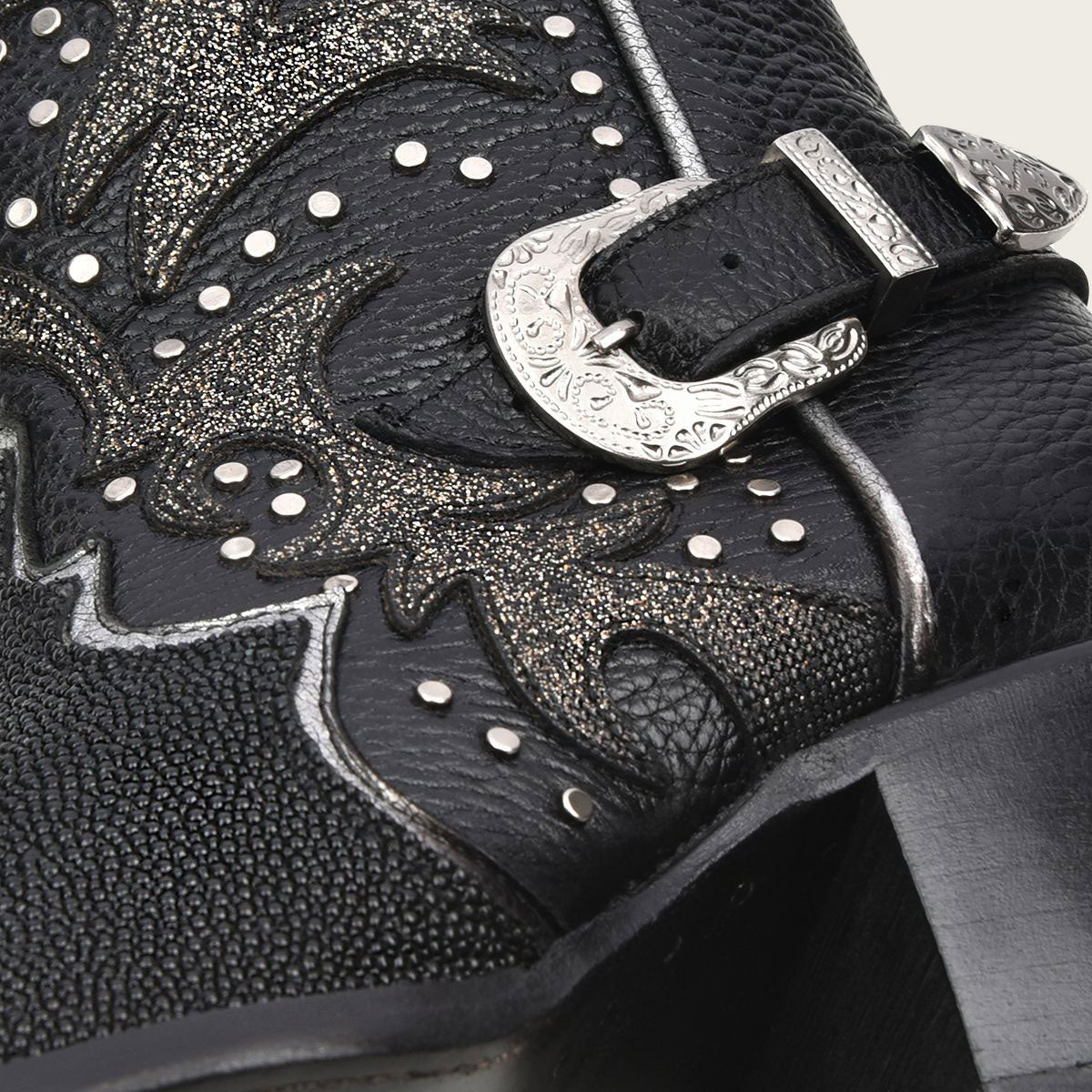 The metallic studs and leather appliqués add edgy glamour to these boots, enhanced by their shiny finish