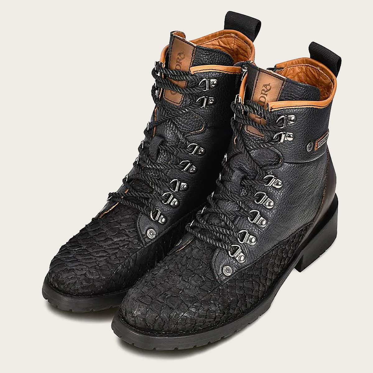 Stylish black poisson leather ankle boots for men, inspired by mining style with metallic accents.