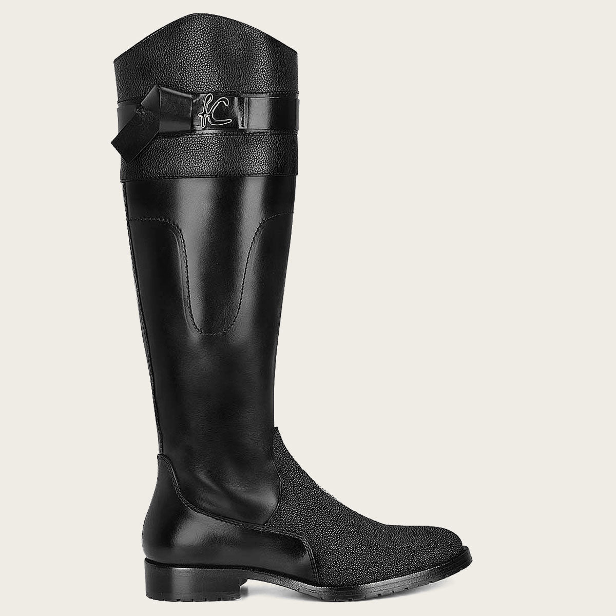 A sleek black riding boot made from exotic stingray leather, perfect for the fashion-forward equestrian.