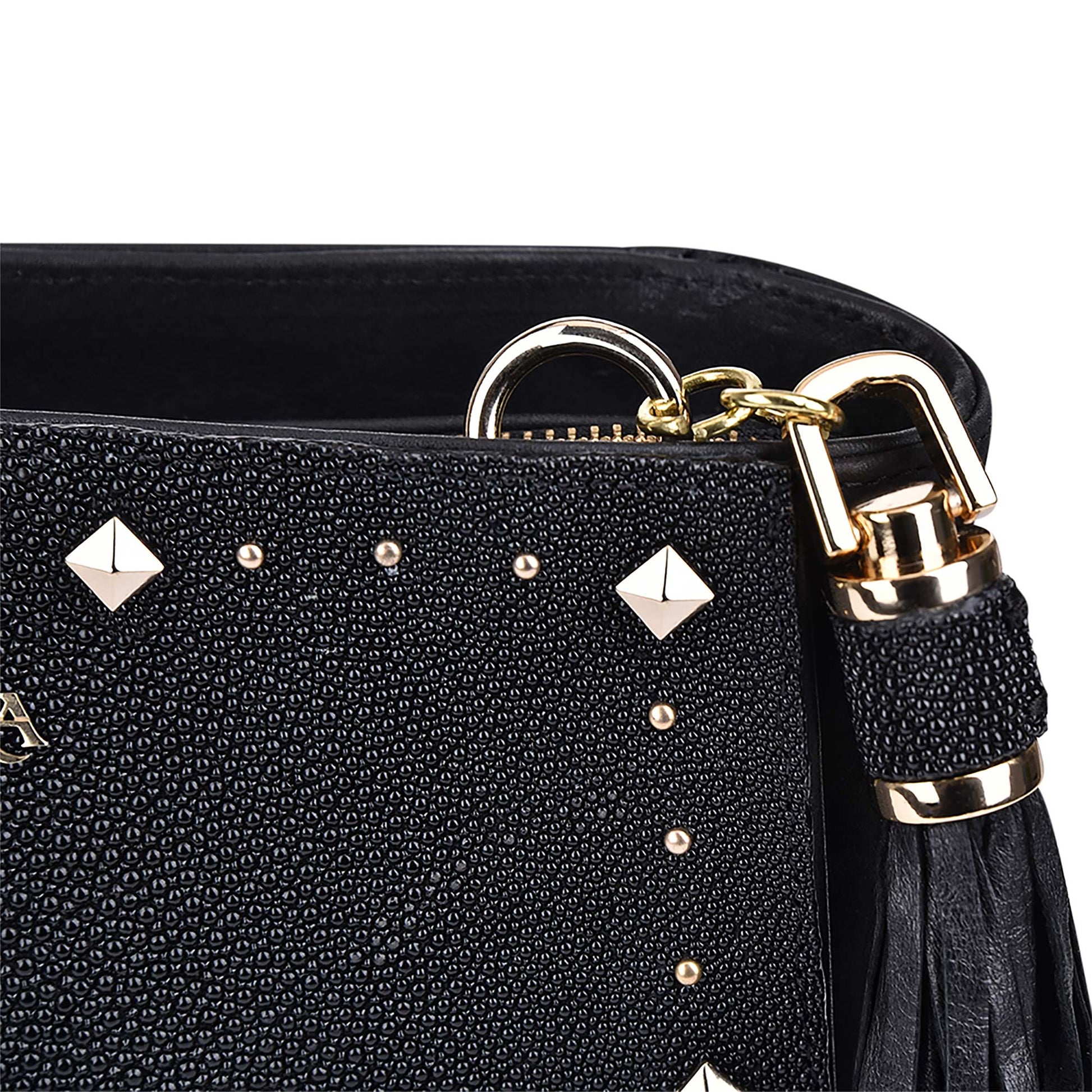 The hanging ovine leather tassel elegantly complements the bag's design.