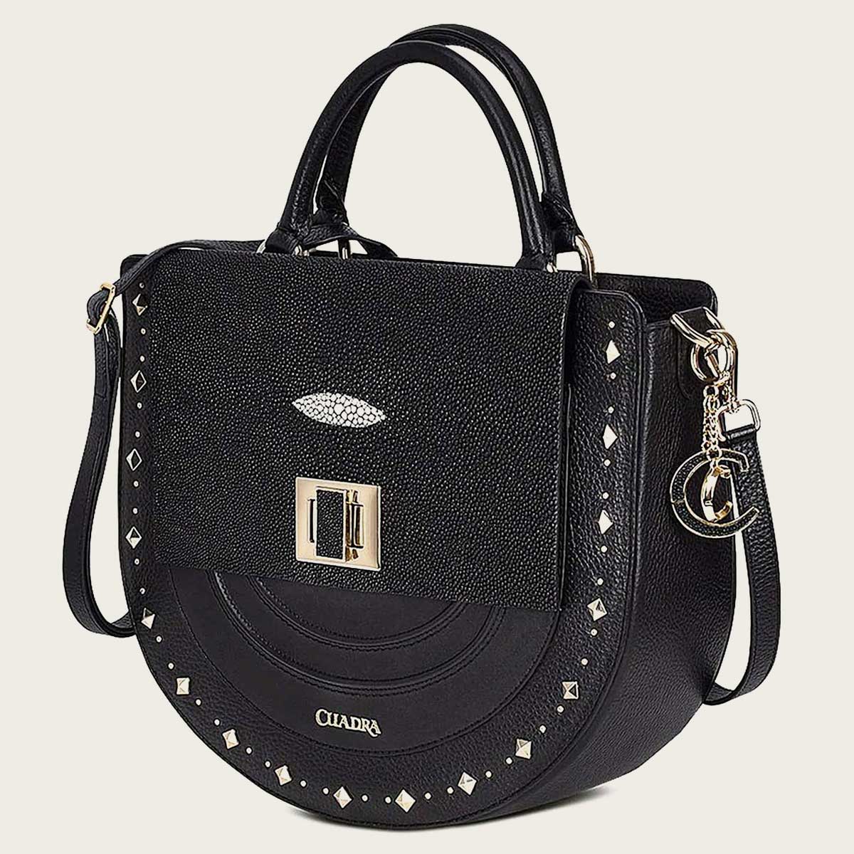 Elevate your style with this black handbag crafted from genuine stingray leather, adorned with studs for a chic and edgy look.