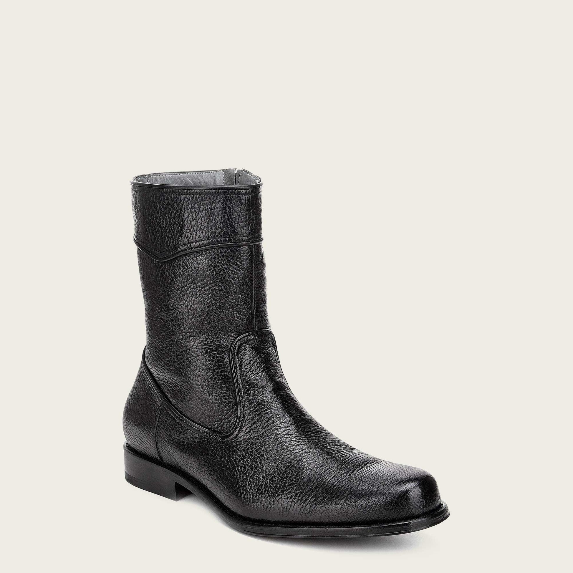 Artisanal hand-painted black leather boot featuring raised edges on the rims for a stylish and rugged look