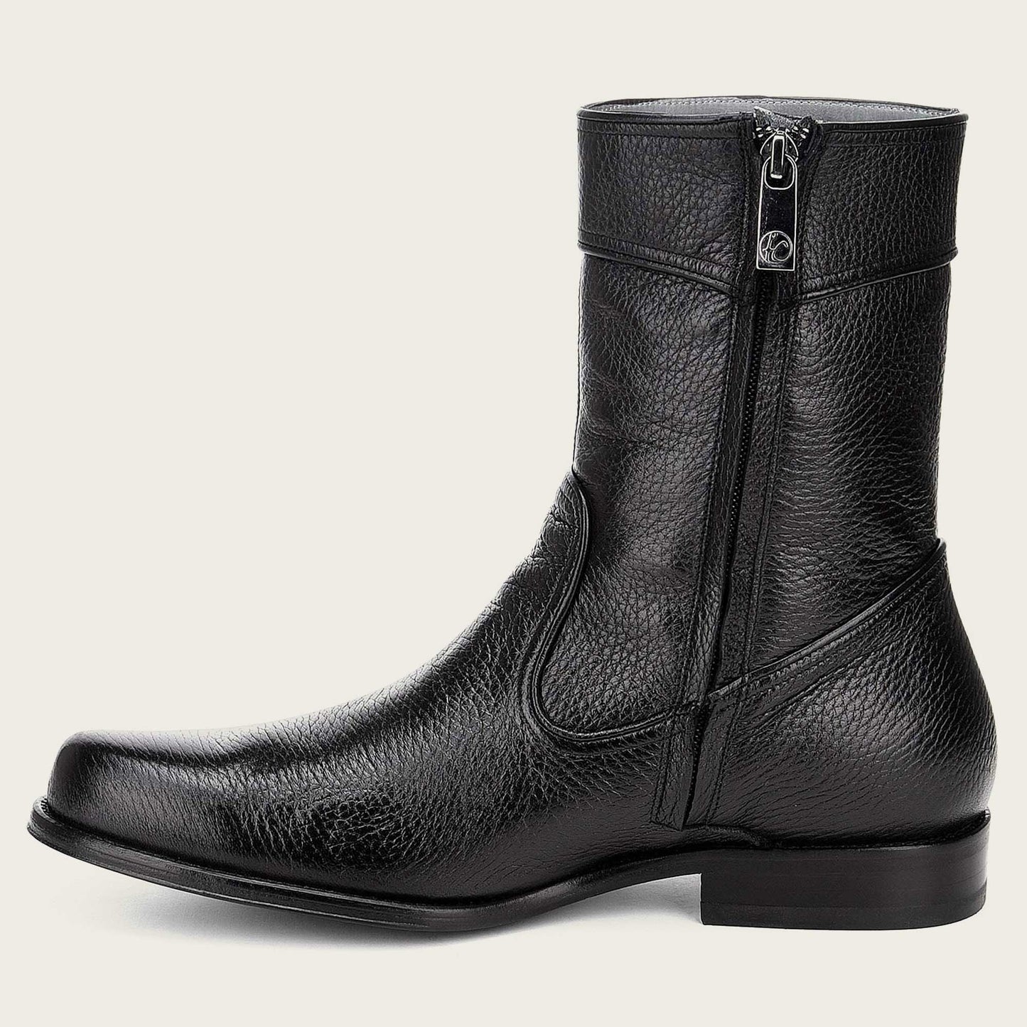 Artisanal hand-painted black leather boot featuring raised edges on the rims for a stylish and rugged look