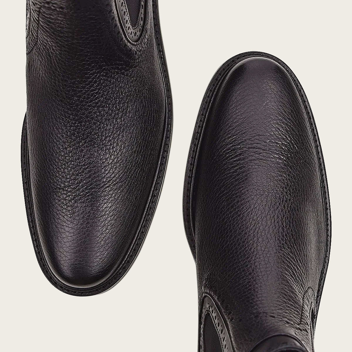 Image of a sleek and minimalistic black deer bootie, perfect for any outfit.